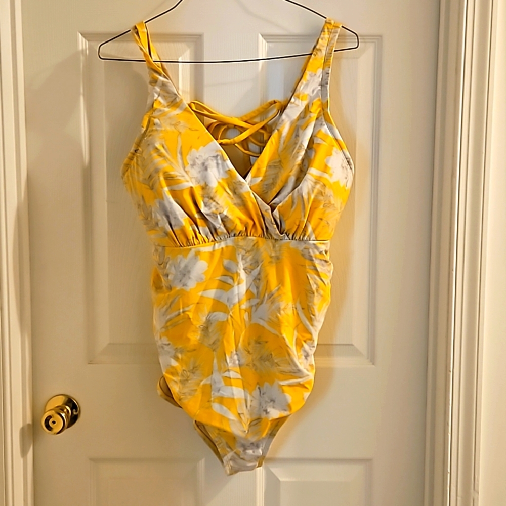 Yellow floral cacique swimsuit with adjustable tie back.